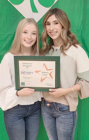 HELPING HAND WINNER—Ochiltree County 4-H held their annual awards ceremony at the Ochiltree County Expo Center on Oct. 14. Addison Lopez was recognized with the Helping Hand Award, which honors a 4-H member who has worked to serve other 4-H members in projects and events. Pictured are, from left, presenter Emmalee Lopez and winner Addison Lopez.