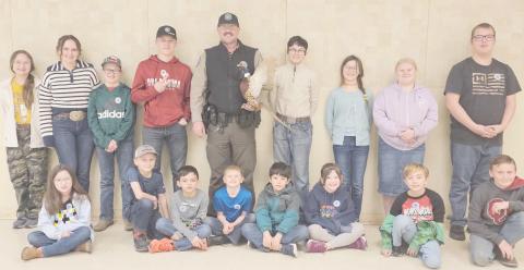 ALAMO CLUB GUEST SPEAKER—Game Warden Jeremy Schwalk was the guest speaker for the Alamo 4-H Club. Pictured are first row, from left, Madison Knox, Matt Oquin, Kyren Rodriguez, Dawson Young, Xander Gonzalez, Gracie Love, Jayden George and Clay Oquin; and in back, Kylee Knox, Rylan Oquin, Brady Oquin, Kyle Oquin, Schwalk, Louie Tarango, Kaylynn Tarango, Rebekah Young and Nathan Knox.