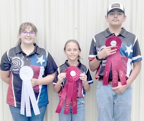 4-H ARCHERS COMPETE AT TRI-STATE FAIR—Students participating in Ochiltree County 4-H’s archery program competed in the Tri-State Fair’s archery competition on Monday, Sept. 15, in Amarillo. There were 40 archers competing in the contest, with ten of those coming from Ochiltree County. Pictured are, from left, Grace Hampton, who won third overall in Recurve Senior, Gabrielle Heck, who took reserve in Recurve Junior, and Ethan Flores, who was reserve in Recurve Senior.