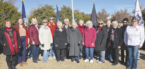 DAR HOLDS WREATHS ACROSS AMERICA EVENT—Ochiltree County once again participated in the nationwide “Wreaths Across America” ceremony at Ochiltree Cemetery. The event is sponsored by the Wolf Creek Chapter of the National Society Daughters of the American Revolution. Pictured are DAR members, from left: Sherrie Rima, Grace Gaertner (who performed the National Anthem) Ruth Ann Noe, Ann Haley, Nan Cook, Cynthia Shattles, Debra Dye, Carol McGarraugh, Barbara Johnson, Kay McGarraugh, Nan Schwalk, Lou Ann Slemmons