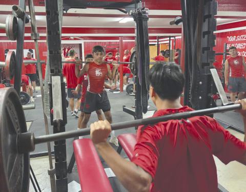 The Perryton High School Rangers have been hard at work for the past few weeks preparing for the upcoming season. While that includes memorizing plays and practicing passes and blocks, it also includes weight training to boost their strength and stamina. Pictured are Ivan Chavez in the back, with Khadyn Juarez spotting just behind him, and Alex Venegas in the foreground. The Rangers will play their season opener on Thursday, Aug. 28, at 7 p.m. in Canyon.