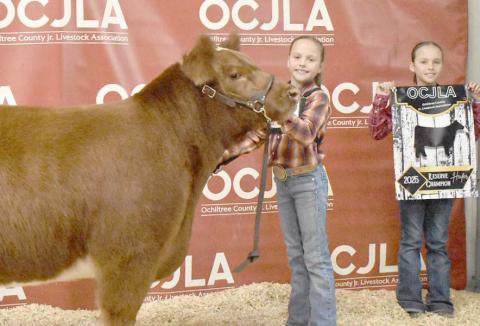 At the Ochiltree County Junior Livestock Show and Sale on Jan. 17-18, the prize for Reserve Grand Champion Heifer went to Izzy Heck. Pictured are, from left, Izzy Heck and Gabby Heck. ( Photo credit: Morgan Dudley)