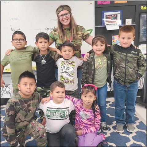 CAMO KIDS Students at Perryton schools had dress-up days during Red Ribbon Week, from Oct. 26-31 to encourage kids to be drug- and bully-free. One Wednesday, students at Wright Elementary School wore camo clothing. Pictured are, from left, front row, Ryan Garcia, Dylan Licon, and Lidia De La Cruz; second row, Emiaj Arreola, Ever Castillo, Alex Becerril, Isabella Camacho, and Luis Medrano; in back is first grade teacher Lucy Cummins.