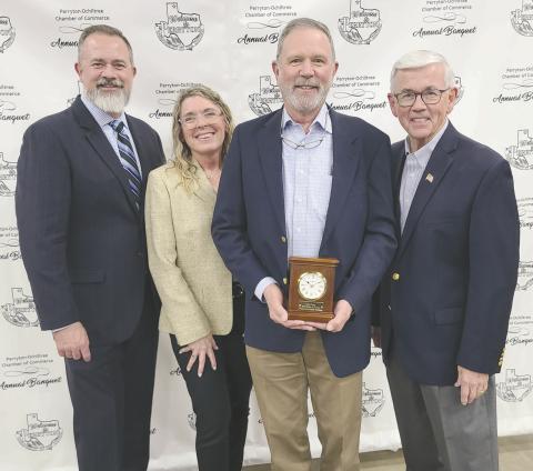 Brady Yeary received congratulations from many well-wishers after he was named the Citizen of the Year on Feb. 22 during the Perryton-Ochiltree Chamber of Commerce’s annual banquet. Pictured are, from left, banquet emcee Kevin Britton, Kim Brown, President and CEO of the Moore, OK Chamber of Commerce, who provided the evening’s entertainment, Yeary, and presenter Randy Brillhart.