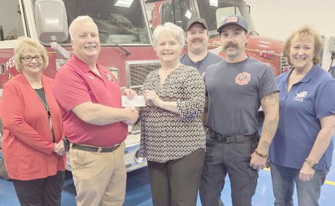 DAR MAKES $1,000 DONATION TO FIREFIGHTERS—