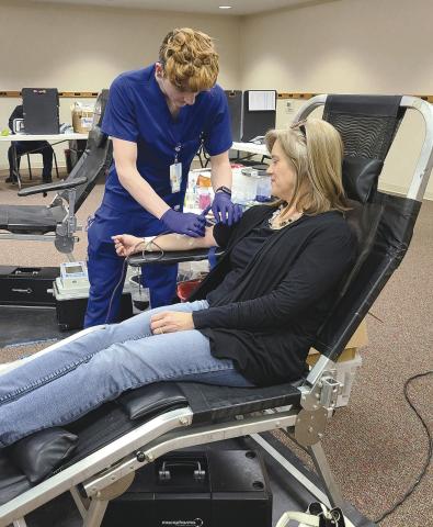 Coffee Memorial Blood Center in Amarillo held a blood drive on Tuesday afternoon at Frank Phillips College, Allen Campus. The drive had a goal of 40 units of blood, but was only able to collect 28 units. A total of 38 people showed up for the drive, but 10 of those were deferred. Pictured are, from left, Coffee phlebotomist Brandon Martinez and donor Nicole Huddleston.