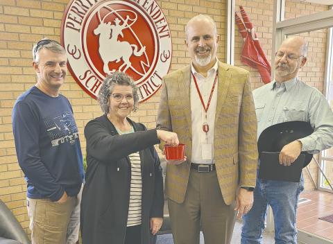 The candidates for the Perryton Independent School District board election met on Monday afternoon at the PISD Administration Building to draw for ballot position for the election. Jeff Schollenbarger will be in first position on the ballot, followed by Bryce Hale, Wes Beal, Nuno Rodriguez, Chris Lingo, and Kevin Pshigoda. Pictured are, from left, Schollenbarger, payroll clerk Lesa Kemp, who drew the names for the ballot, PISD Superintendent Greg Brown, and Beal.