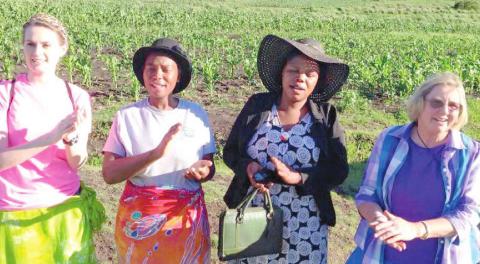 Kamber Burleson Henson, two Lesotho residents and Carolyn Thurman