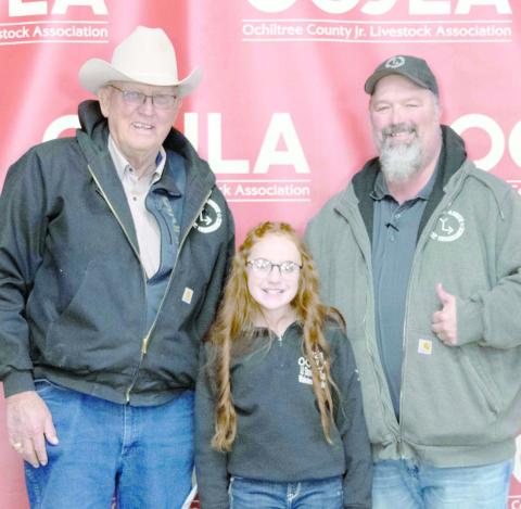 GRAND CHAMPION HEIFER— At the Ochiltree County Junior Livestock Show and Sale on Jan. 16-17, Blakelee Gillispie took home the award for Grand Champion Heifer. Her animal was purchased by Broken Arrow Crop Insurance. Pictured are, from left, Larry Schickedanz, Blakelee Gillispie, and Jason Schickedanz. ( Photo credit: Hailey Clark of Hailey Renee Photography)