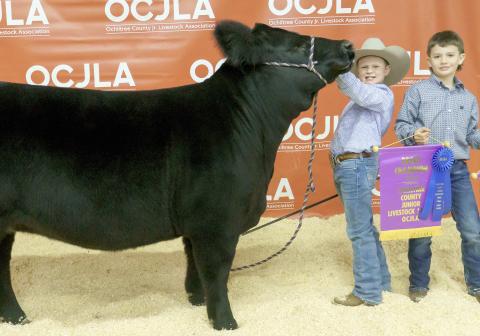 GRAND CHAMPION HEIFER— At the Ochiltree County Junior Livestock Show and Sale on Jan. 20-21, Teaghan Morgan took home the award for Grand Champion Heifer. Pictured are, from left, Teaghan Morgan and McCoy Barnett. ( Photo credit: Brittany Morgan)