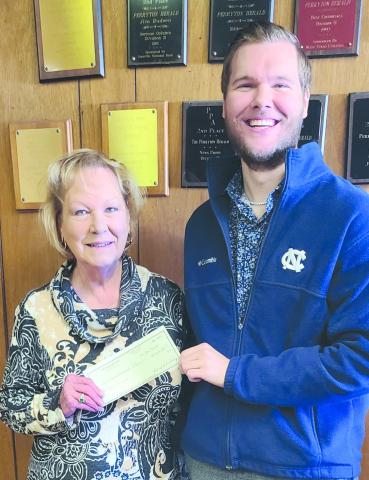 Daniel Hillman emerged the winner of the Herald’s annual football contest, accumulating 60 points for the win. As the winner he received four tickets to a semifinal college playoff game at AT&amp;T Stadium in Arlington, valued at around $1,500. He also received $200 in expense money. Pictured with him is Herald publisher Mary Dudley.