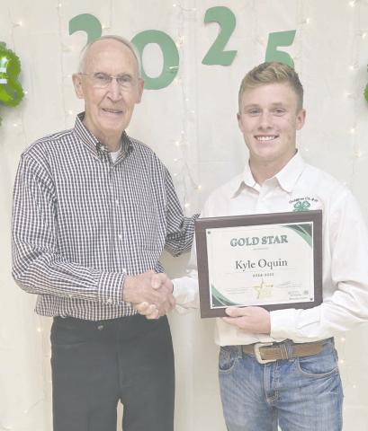 Ochiltree County 4-H held their annual awards ceremony Tuesday evening at the Ochiltree County Expo Center. The winner of the Gold Star Award, the highest county award that can be given to a 4-H member was Kyle Oquin, who received a plaque from the county, a pin, and a certificate from the state. Pictured are, from left, County Judge Charles Kelly, who presented the award, and Oquin.