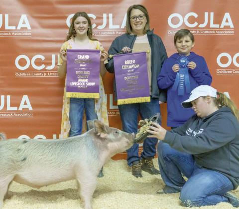 GRAND CHAMPION SWINE— At the Ochiltree County Junior Livestock Show and Sale on Jan. 20-21, Caydee Butler took home the award for Grand Champion Swine. Her animal was purchased by Duvall Farms. Pictured are, from left, Caydee Butler, Cindy Duvall, Graham Duvall, and Casidee Butler. ( Photo Credit: Brittany Morgan)