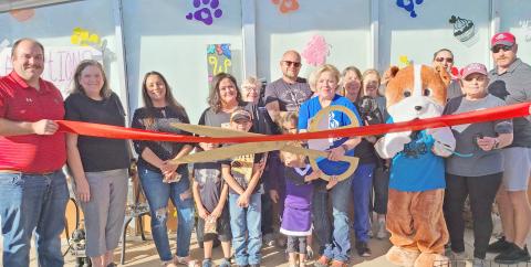 RIBBON CUTTING FOR MUTT HUTT BAKERY— Perryton-Ochiltree Chamber of Commerce members gathered last Friday afternoon for a ribbon-cutting ceremony to commemorate the grand opening of the Mutt Hutt Bakery and Boutique at 212 SW 3rd Street in Perryton. The pet bakery and boutique is owned by Ryan and Audra Wells.