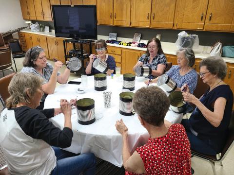CREATING HOMEMADE DECOR The Ochiltree County Senior Citizens Center held a crafting day on Monday afternoon. Members at the center made tabletop centerpiece decorations and wasp/insect traps. Pictured are, clockwise from bottom right: Nancy Cain, Frances Aston, Penny Clark, Toni Boren, Becky Childers, Charlotte Cape, and Kay Allison.