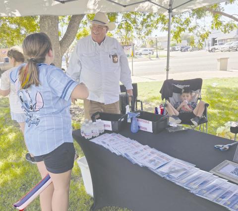 The annual block party, sponsored by the Perryton Ochiltree Chamber of Commerce, brought local residents out last Thursday evening to enjoy snacks and activities at the county courthouse and along downtown Main Street. Ochiltree County Sheriff Terry Bouchard and his staff from the Sheriff’s Office sponsored a booth at the courthouse lawn to distribute kids’ DNA kits, along with fun activity booklets.