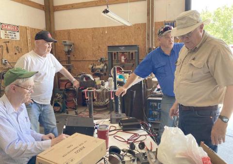 NATIONAL FIELD DAY—Members of the Top of Panhandle Amateur Radio Club participated in the AARL National Field Day on June 26. The idea behind the day was to practice communication skills in case of a disaster. Pictured are, from left, Jerome Doerrie, Larry Chancellor, Jim Lear and Dempsey Malaney.