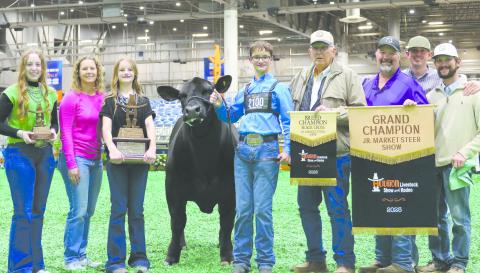 SCHICKEDANZ SHOWS GRAND CHAMPION STEER AT HOUSTON PHS sophomore Jack Schickedanz exhibited the Grand Champion Steer at the Houston Livestock Show, as well as the Grand Champion Market Steer at the Austin Rodeo. Jake’s steer was selected out of 2,000 steers in Houston. Pictured are, from left, Maddie Schickedanz, Amber Schickedanz, Sydney Schickedanz, Kareem the steer, Jake Schickedanz, Larry Schickedanz, Jason Schickedanz, mentor Kirby Eaves, and steer coach Kyle Tarter.
