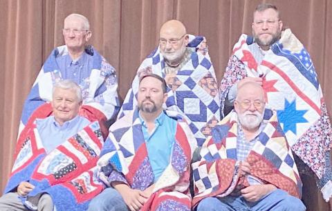 QUILTS OF VALOR HONOREES— The second group of veterans presented Quilts of Valor by the Friendship Quilt Guild on Oct. 16 were, first row, from left, Willis Smith, Byron Hoover and Robert Freeman; and second row, Bob Karber, Earl Hill and Jeff Mincy.