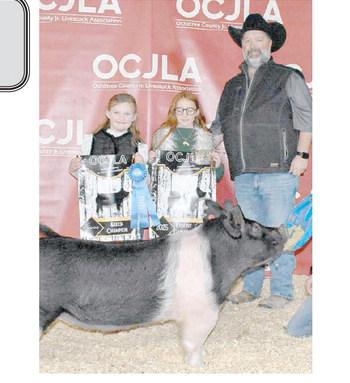 The award for Reserve Grand Champion Swine at the Ochiltree County Junior Livestock Show and Sale on Jan. 17-18 went to Blakelee Gillispie. The animal was purchased by Broken Arrow Crop Insurance. Pictured from left are Tylar Morgan, Blakelee Gillispie, and Jason Schickedanz. ( Photo credit: Morgan Dudley)