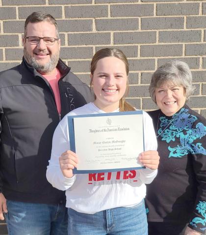 GOOD CITIZENS AWARD— Perryton High School senior Maisy McGaughy, center, has been named the recipient of the DAR Good Citizens $1,,000 scholarship. As the winner, her essay packet advances to state competition. Pictured with her are her father, Sam McGaughy, left, and DAR member Cheryl Bullard.