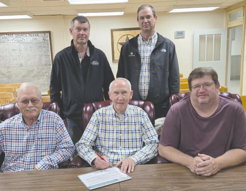 Ochiltree County Judge Charles E. Kelly signed a proclamation on Tuesday morning commemorating this year’s Soil and Water Stewardship Week, April 27 through May 4, recognizing the importance of preserving and conserving healthy soil, clean water, and natural habitats in Ochiltree County. Pictured are, from left, front row: director Terry Slaughter, Judge Kelly, and director Kevin Pshigoda; back row: director Torben Hansen and director Eric Philipp. See story on page 8 for more information.