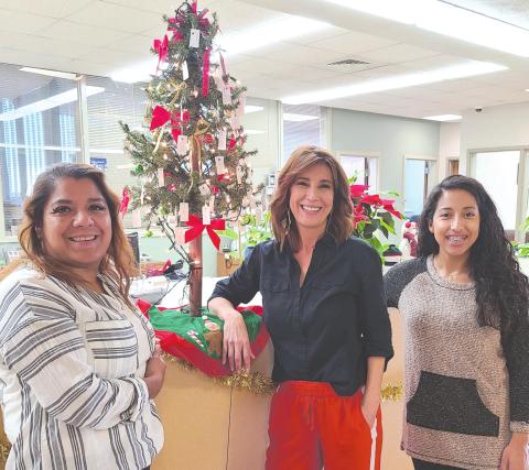 GIVING TREE SET UP FOR DONATIONS AT CITY HALL The City of Perryton has set up its Giving Tree in City Hall to assist local senior citizens who have difficulty paying their winter heating bills. Anyone can make anonymous donations to help pay utility bills for area seniors. Pictured with the tree are, from left, city employees Patty Martinez, Laura Rivera, and Sandra Sosa.