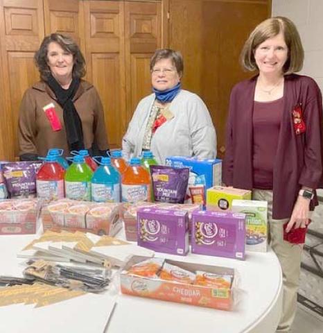 CRISIS CENTER GIFTS—The Eta Alpha chapter of Delta Kappa Gamma purchased snacks and arts and crafts items for the Panhandle Crisis Center as its project. Pictured are, from left, Lana Yeary, Sharon Cummings and Renee Lee.