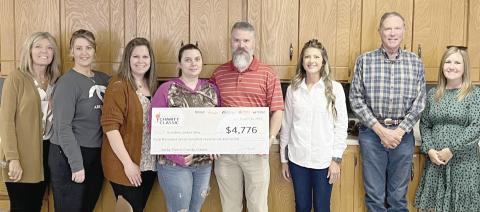 UNITED WAY DONATION— The Ochiltree United Way received $4,776, part of the proceeds from the 2022 Jacky Pierce Charity Class Golf Tournament, held in Lubbock. Sponsored by United Supermarkets, the proceeds provided $500,000 in funding for 27 nonprofit charities in Texas and New Mexico. The check was presented to the United Way board at its last meeting. Pictured, from left, are Marcia Hale, Stephanie Pulpan, Jennie Itara, Crystal Harper, Brent Harper, Amanda Cowan, Brady Yeary and Laycee Johnson.