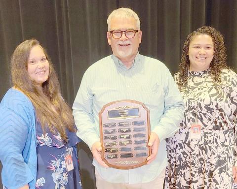 TEACHER OF THE YEAR— This year’s Excellence in Education Award, presented during the annual awards ceremony at Perryton High School on May 1, was presented to PHS choir teacher Keith Harris. Pictured are, from left, PHS principal Tori Little, Harris, and vice principal Francis Zavala.
