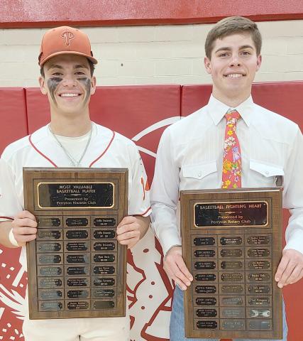 BOYS BASKETBALL AWARDS— Perryton High School’s boys basketball team was honored May 1 at the Perryton High School All Sports Awards Banquet. Pictured are, from left: Julian Cervantes, who brought home the MVP award, and Tad Pshigoda, winner of the Fighting Heart award.