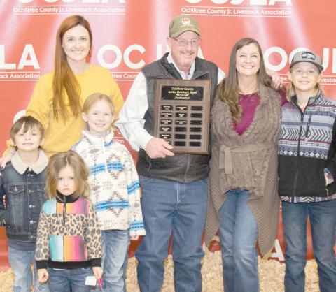 STOCK SHOW DEDICATED TO GASTINEAU— This year’s Ochiltree County Junior Livestock Show and Sale was dedicated to Richie Gastineau. Pictured are, in front, Bridgette Cole; in middle row, from left, Archie Cole and Scarlett Cole; and back row, Britta Cole, Richie Gastineau, Tanya Gastineau, and Silas Cole. ( Photo credit: Tessa Powell)