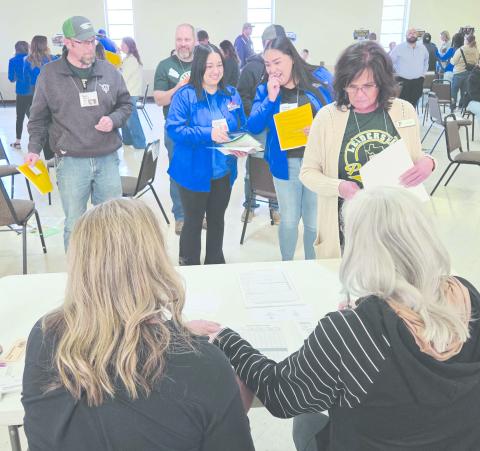 Members of Leadership Perryton XXIV participated in Reality Day, a poverty simulation, on Wednesday, learning about some of the realities and challenges faced by low-income families. Participants in the simulation were given simple roles to play during the project, including newly unemployed people, homeless people, recipients of TANF funds, senior citizens on disability, and single parents. The task assigned to all was to provide basic necessities and shelter during the course of four 15-minute weeks.