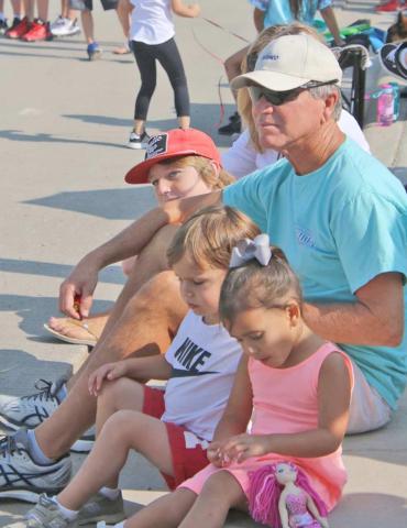Doug Hale at Wheatheart parade with three of his eight grandchildren