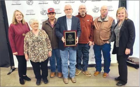 North Plains Electric Co-op was named the Corporate Citizen of the Year by the Perryton-Ochiltree Chamber of Commerce during its annual banquet on Feb. 22. Pictured from left are Wheatheart Council co-president Denise Wilmoth, executive secretary Paula Lehew, utility tech Martin Garza, executive vice president/general manager Randy Mahannah, engineering services manager Joe Lane, operations manager Ronald Harvey, and Wheatheart Council co-president Pam Chisum.