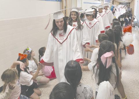 Perryton High School’s graduating seniors walked through other Perryton Independent School District campuses last Thursday morning to accept congratulations from other students. Seniors started their tour through PHS before continuing to Perryton Kinder, Perryton Junior High, Wright Elementary, and Williams Intermediate.