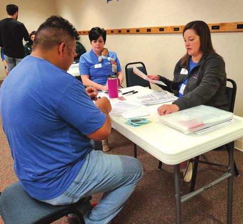 LEARNING ABOUT POVERTY Members of Leadership Perryton XIX participated in a Community Action Poverty Simulation on Friday, learning about some of the realities and challenges faced by low-income families. Participants took on the roles of families trying to provide basic necessities and shelter while volunteers portrayed community organizations, banks, employers, and more. Pictured are, from left, Mac Hernandez, Angela Petersen (with “baby”), and Kim Fowler, portraying a social services agency.