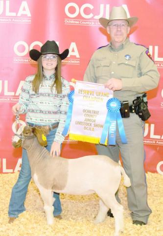 RESERVE GRAND CHAMPION GOAT— At the Ochiltree County Junior Livestock Show and Sale, Amelia Jumper took home the award for Reserve Grand Champion Goat. Her animal was purchased by Steven Jenkins. Pictured are, from left, Amelia Jumper and Steven Jenkins. (Photo credit: Tessa Powell)