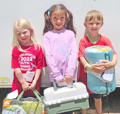 SMALL FRY, BIG FISH—Kids turned out in droves for Saturday’s Children’s Fishing Tournament at Lake Fryer and Wolf Creek Park. The top prize winners in the ages 3-6 category were, from left, Alice DeWitt (first place), Zoey Yara (second), and Camden Robinson (third).