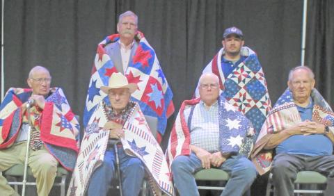 QUILT OF VALOR RECIPIENTS— Among the 16 veterans honored with Quilts of Valor by the Friendship Quilt Guild were seven men honored in the second group. They were, first row, from left, Billy Britt Jarvis, Dick Wilberforce, Wallace Forrest and Ken Schafer; and second row, John Worthington and Mike Itera. Not pictured is Robert Cruz. The special presentation was made Oct. 20.