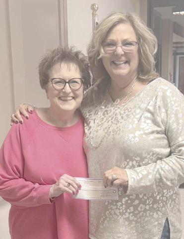 SENIOR CENTER MAKES DONATION— Booker Lions Club president Donna Sheppard, at left, accepted a check for $707 from Daryla Allred, the director of the Ochiltree County Senior Citizens Association, for the Fire Relief Fund benefitting the employees of Preferred Beef Group. Allred made the presentation recently at the weekly Booker Lions Club meeting. The donation was collected from members of OCSCA.