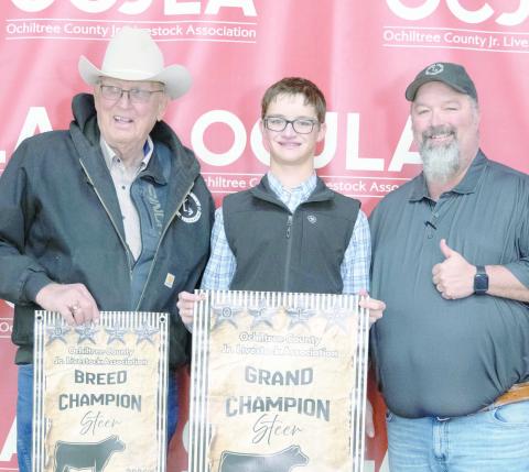 This year’s Grand Champion Steer at the Ochiltree County Junior Livestock Show and Sale on Jan. 16-17 was awarded to Jake Schickedanz. The animal was purchased by Chris Smith Wealth Management and Ag Ingenuity. Pictured are, from left, Larry Schickedanz, Jake Schickedanz, and Jason Schickedanz. (Photo credit: Hailey Clark of Hailey Renee Photography)