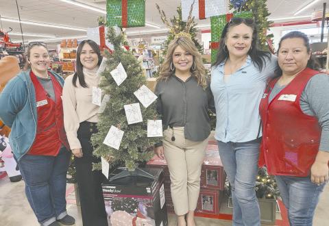 The Panhandle Crisis Center is offering the opportunity to help children and families in need this Christmas with the Angel Tree Project, with Angel Trees set up in local businesses to let benefactors purchase gifts for kids. Pictured with the Angel Tree in Tractor Supply are, from left, Samantha Mills, Crisis Center advocate Valeria Najera, community educator Delma Lopez, Lisa Kerl, and Yuri Rosales.