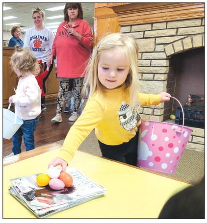 Perry Memorial Library’s last Story Time session of the year on Wednesday morning gave youngsters attending the program the chance to hunt for Easter eggs hidden around the library, in addition to listening to some stories and working on some arts and crafts projects. Yates Correll, age 3, came across a treasure trove of eggs in the library’s lobby.