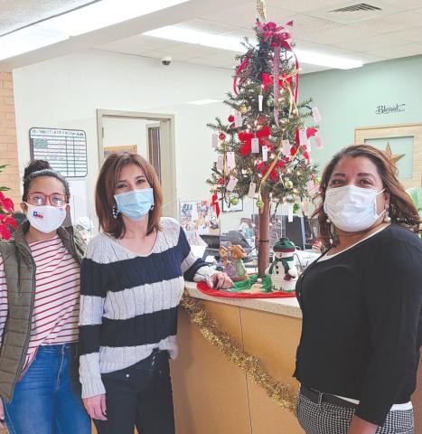 GIVING TREE AT CITY HALL The City of Perryton has set up their Giving Tree in City Hall to assist local senior citizens who have difficulty paying their winter heating bills. Anyone can make anonymous donations to help pay utility bills for area seniors. Pictured with the tree are city employees Sandra Sosa, Laura Rivera, and Patty Martinez.