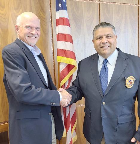 NEW POLICE CHIEF SWORN IN— The Perryton Police Department’s new chief, Nick Yara, was officially sworn in on Monday afternoon by City of Perryton Secretary Kim Fowler. Yara succeeds former chief Mike Smith, who officially retired last Friday. Pictured are Yara, at right, with Perryton City Manager David Landis.