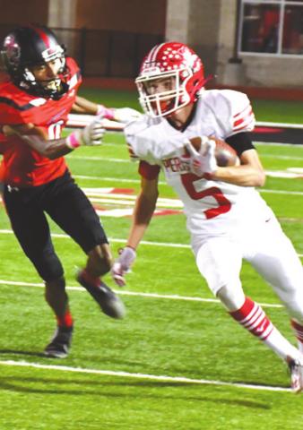 DISTRICT WIN Ranger Cuyler Feger (being defended by Lobo Matthew Bautista) one of several Rangers who had a big night on Friday against the Levelland Lobos. Feger caught six passes in the game, as the Rangers blew by Levelland, 44-10 to open district play.