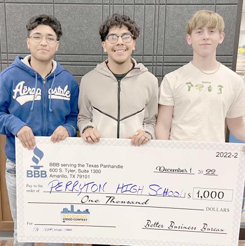 PHS STUDENTS WIN VIDEO CONTEST— Students in Perryton High School’s A/V Club submitted a video to the Better Business Bureau video contest in Amarillo, placing second and receiving a $1,000 check for new equipment for the club. The winning students were, from left, Sergio Campos, Edwin Ochoa, and Alex Jarrell. Not pictured is Samuel Perez.
