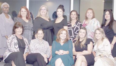 CHAPTER OF YEAR— Texas Municipal Clerks Association President Lee Woodward (standing back row, third from left) with City Secretary Kim Fowler (standing back row, third from right) pose with other Panhandle Chapter members at the TMC annual banquet in South Padre Island.The chapter was recognized as Chapter of the Year by the association.
