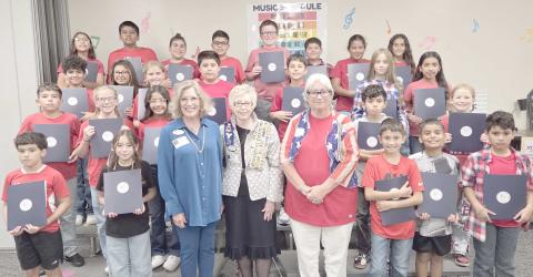 DAR CELEBRATES CONSTITUTION DAY AT WILLIAMS— Members of the local Wolf Creek chapter of the National Society Daughters of the American Revolution visited Williams Intermediate Elementary School last Thursday to commemorate Constitution Week by delivering copies of the United States Constitution for every fifth grade classroom. Pictured with a small horde of Williams fifth graders are, in front, Melodee Rogers, Barbara Johnson, and Debra Dye.